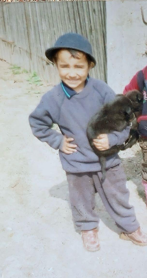 Young Daniel Stoican as a child growing up in Bucharest, Romania before moving to Nottingham, England